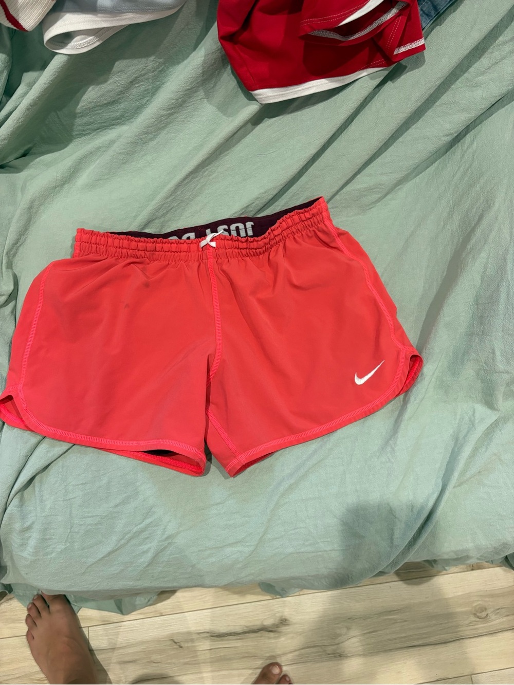 Nike Coral Athletic Running Shorts with White Swoosh